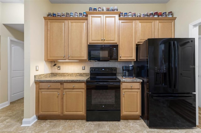 kitchen featuring decorative backsplash, baseboards, black appliances, and light brown cabinetry