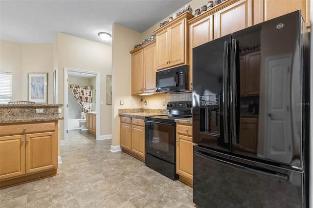 kitchen with baseboards, dark stone countertops, a textured ceiling, black appliances, and backsplash