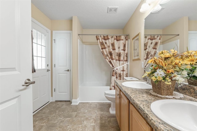 bathroom featuring toilet, a sink, visible vents, shower / tub combo with curtain, and double vanity