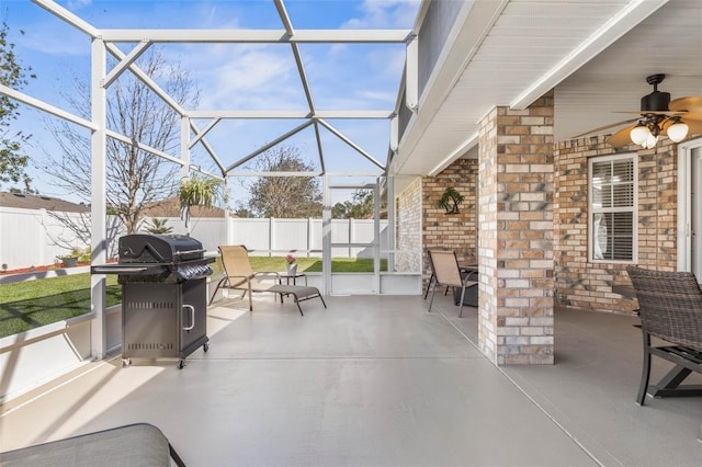 view of patio / terrace featuring a ceiling fan, a lanai, fence, and grilling area