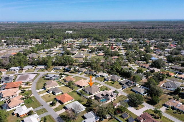 aerial view with a residential view and a view of trees