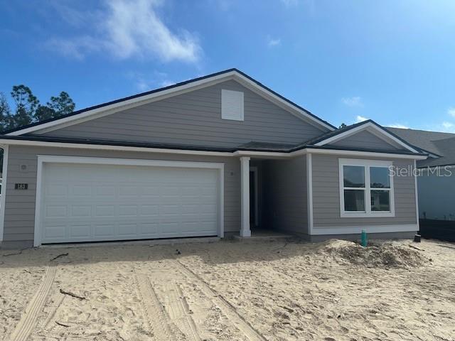 single story home with a garage