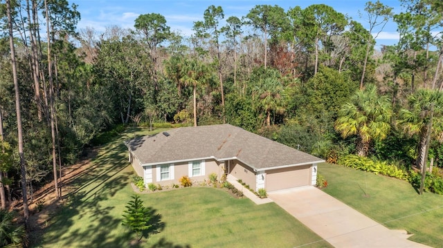 view of front of home with a garage and a front yard