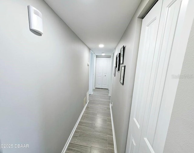 hallway featuring hardwood / wood-style flooring