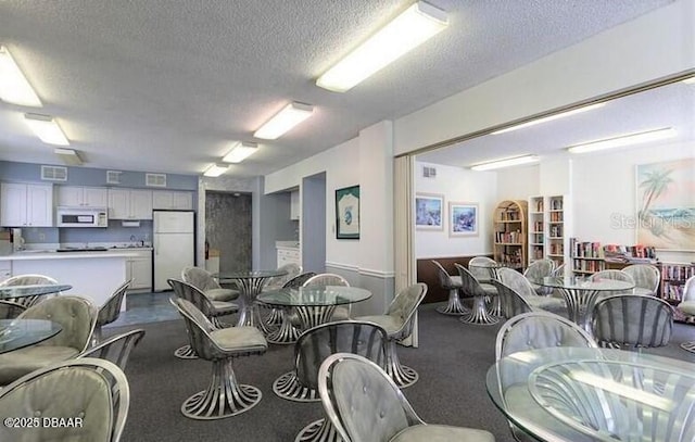 dining area with a textured ceiling