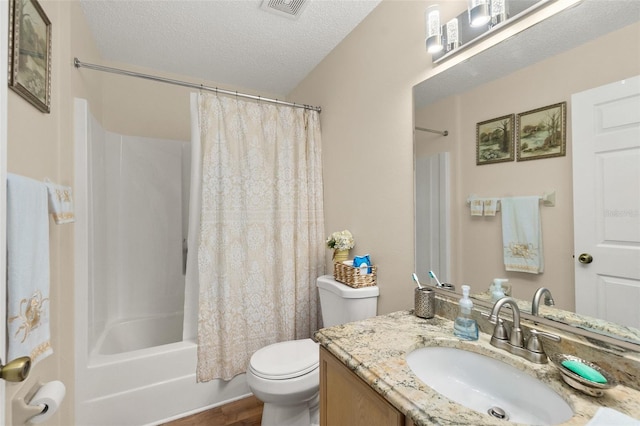 full bathroom with toilet, vanity, a textured ceiling, and shower / bath combo