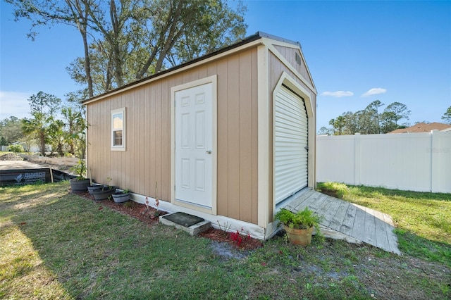 view of outbuilding featuring a lawn