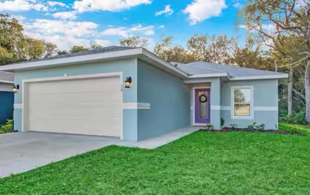 single story home featuring a garage and a front yard