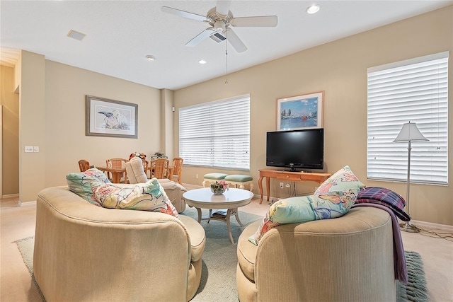 living room with light colored carpet and ceiling fan