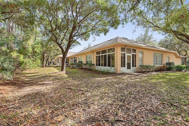 back of house with a sunroom