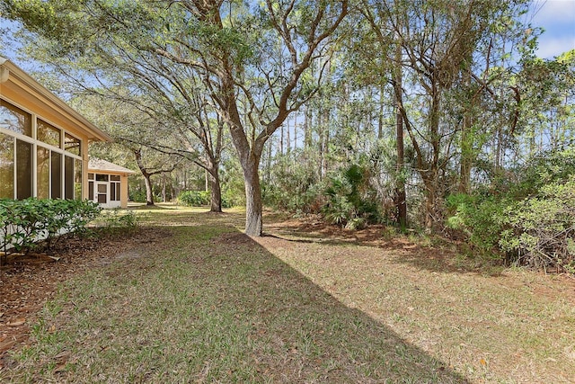 view of yard with a sunroom