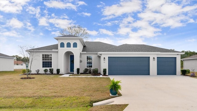 view of front of property featuring a garage and a front yard