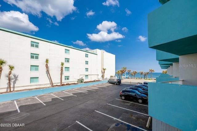 view of parking with a water view