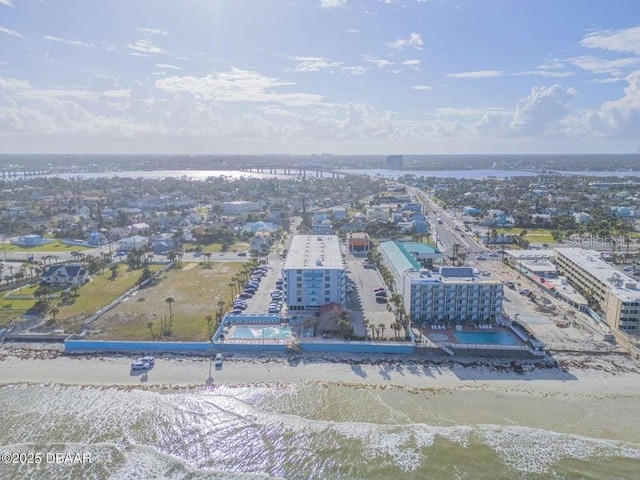 drone / aerial view with a water view and a view of the beach