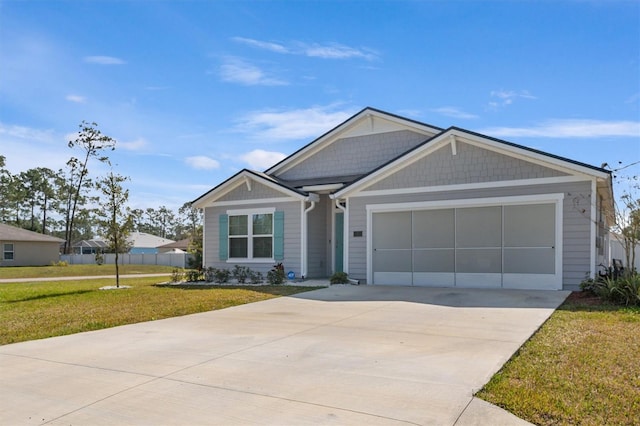 view of front facade with a garage and a front yard