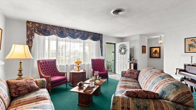 living room with carpet flooring and a textured ceiling