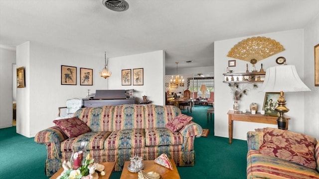 carpeted living room featuring a notable chandelier