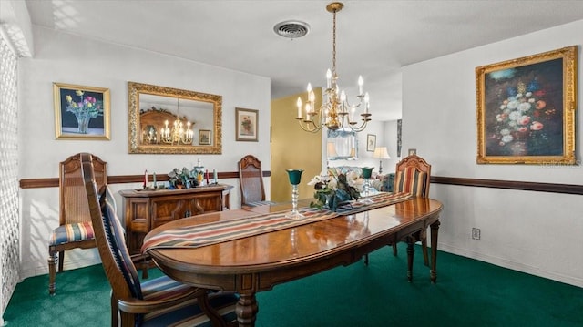 dining room featuring a chandelier and carpet