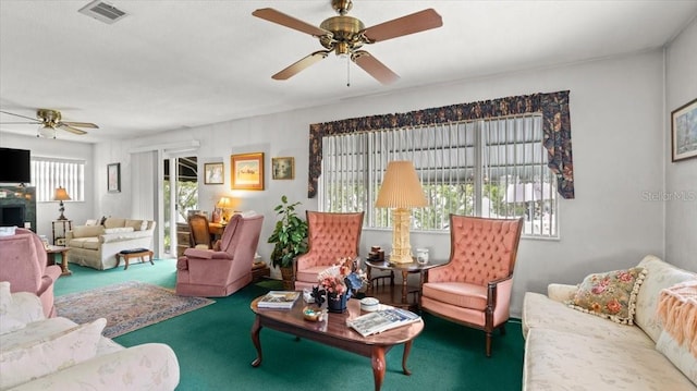 living room featuring ceiling fan and carpet flooring