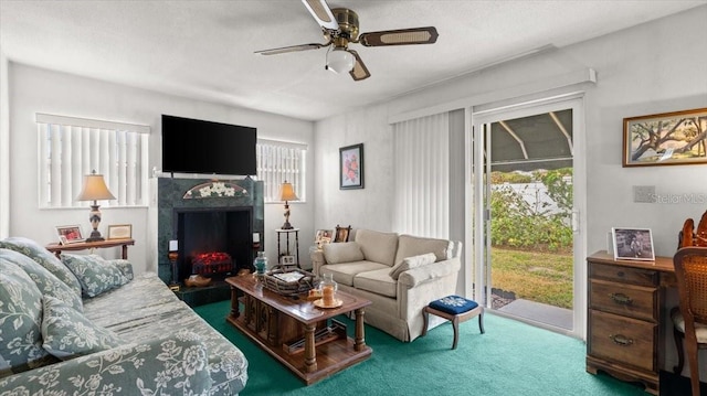 carpeted living room featuring ceiling fan