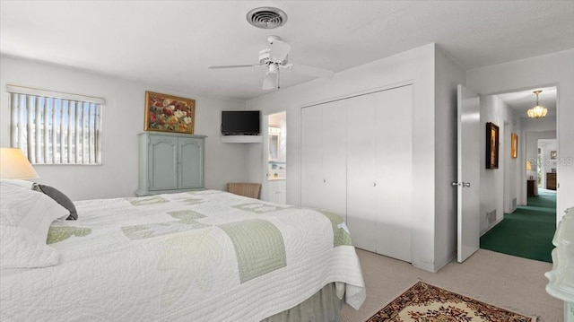 bedroom with light carpet, a closet, and ceiling fan