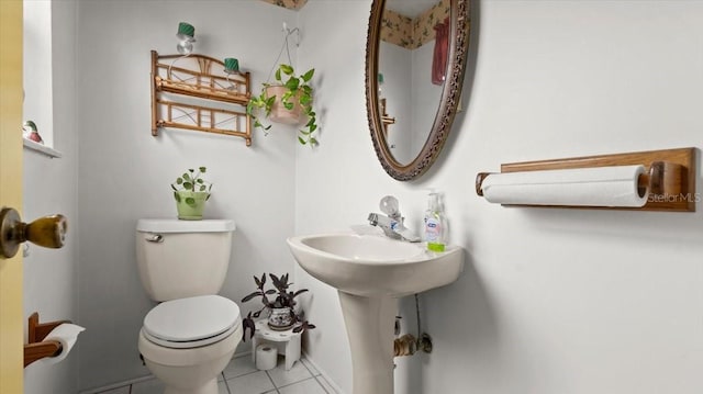 bathroom featuring tile patterned floors and toilet