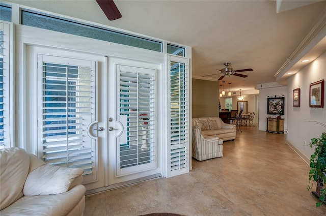 doorway to outside featuring french doors, crown molding, and ceiling fan