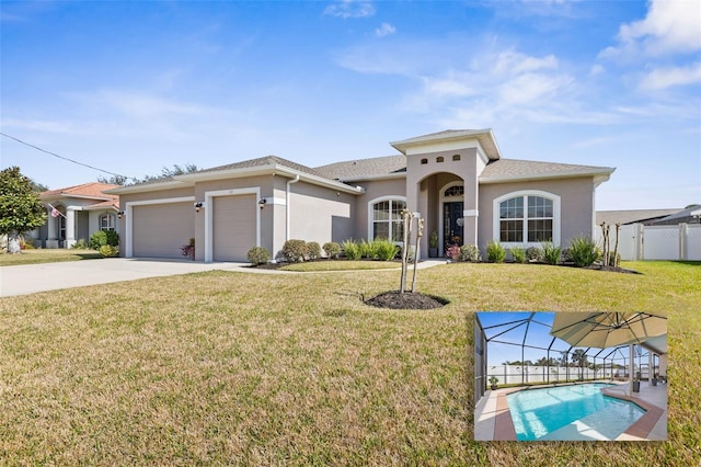 view of front of home with a garage and a front yard