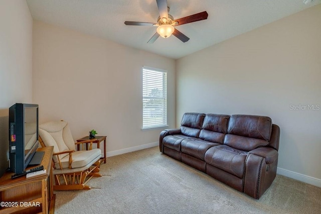 living room with ceiling fan and light colored carpet