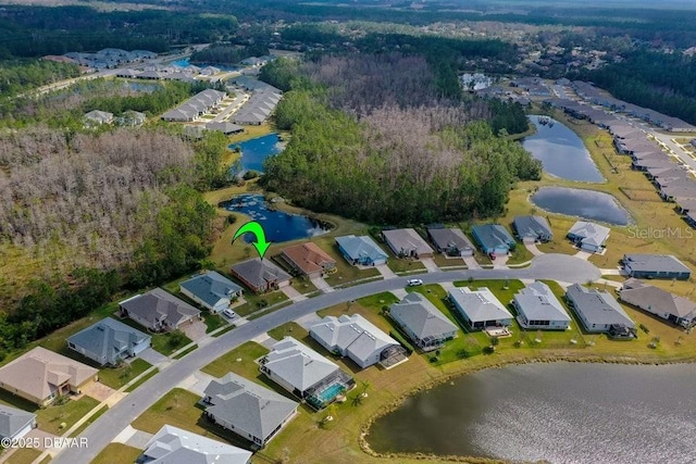 drone / aerial view with a water view