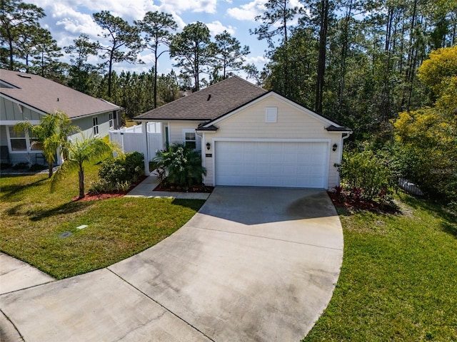 view of front of house featuring a garage and a front yard