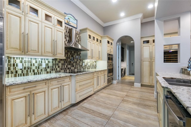 kitchen featuring dishwashing machine, decorative backsplash, light stone counters, wall chimney range hood, and black electric cooktop