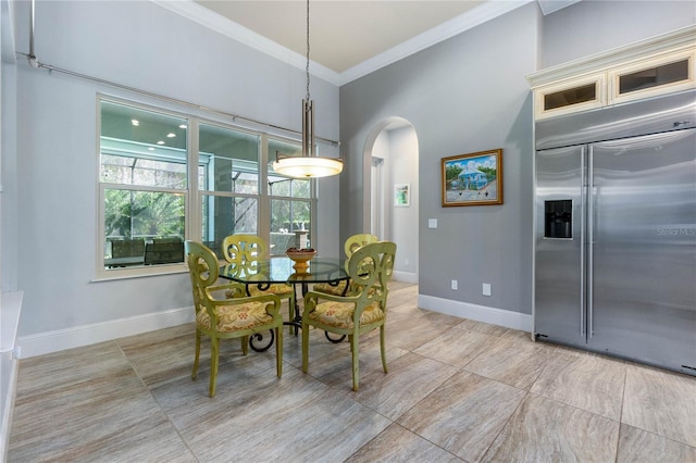 dining area with ornamental molding