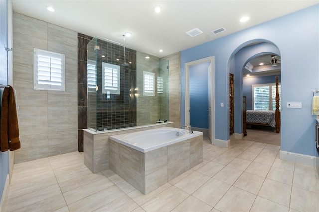 bathroom featuring tile patterned floors and independent shower and bath