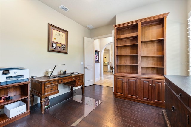 office space with dark wood-type flooring