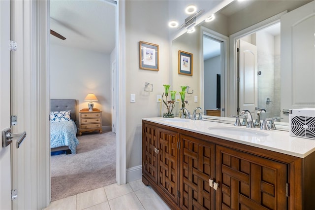 bathroom featuring tile patterned flooring, vanity, a shower, and ceiling fan