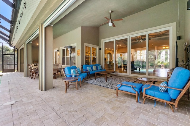 view of patio with ceiling fan, an outdoor hangout area, and a lanai