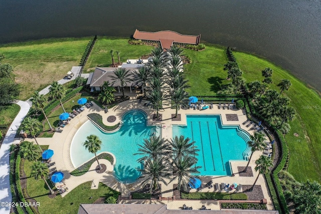 birds eye view of property with a water view