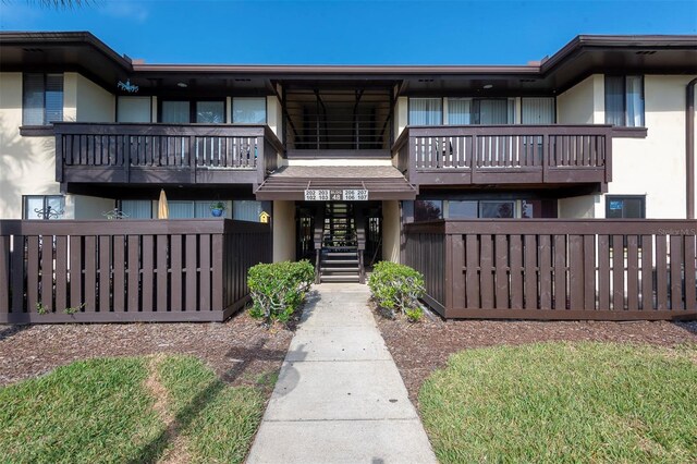 48 Club House Dr Unit 106, Palm Coast, FL 32137 - view of property featuring fence