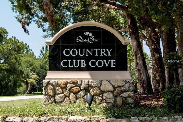 48 Club House Dr Unit 106, Palm Coast, FL 32137 - view of community / neighborhood sign
