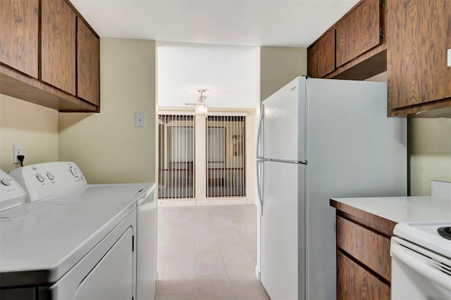 48 Club House Dr Unit 106, Palm Coast, FL 32137 - washroom with washer and dryer and laundry area
