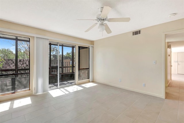 48 Club House Dr Unit 106, Palm Coast, FL 32137 - unfurnished room with baseboards, visible vents, and ceiling fan
