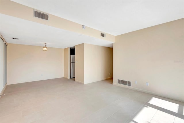 48 Club House Dr Unit 106, Palm Coast, FL 32137 - spare room featuring baseboards and visible vents