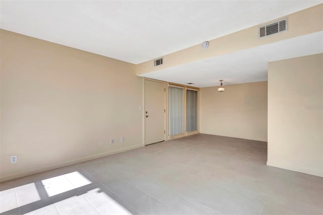 48 Club House Dr Unit 106, Palm Coast, FL 32137 - empty room featuring baseboards and visible vents