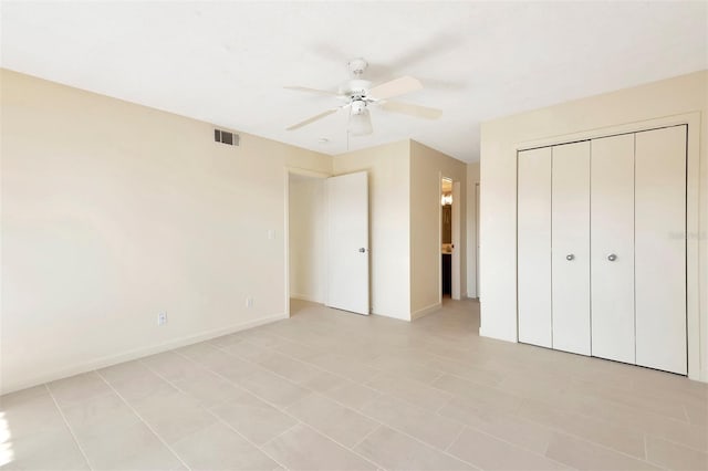 48 Club House Dr Unit 106, Palm Coast, FL 32137 - unfurnished bedroom featuring a closet, baseboards, ceiling fan, and visible vents