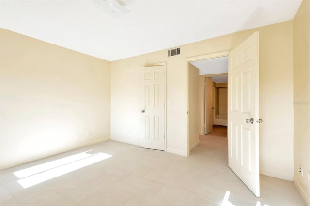 48 Club House Dr Unit 106, Palm Coast, FL 32137 - unfurnished bedroom with baseboards and visible vents