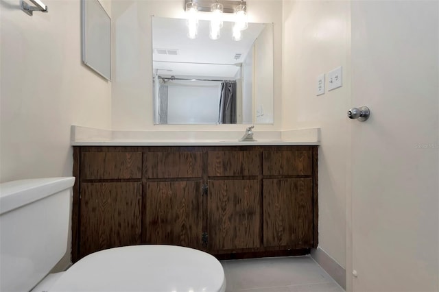48 Club House Dr Unit 106, Palm Coast, FL 32137 - bathroom with toilet, vanity, baseboards, and visible vents