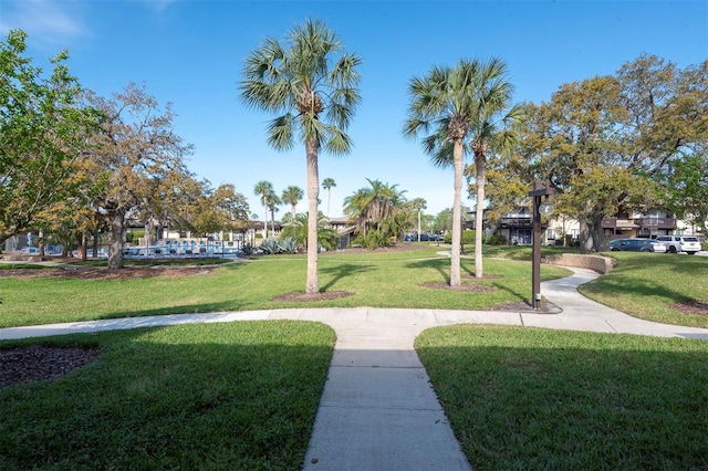 48 Club House Dr Unit 106, Palm Coast, FL 32137 - view of community featuring a lawn