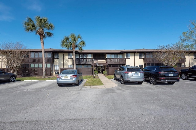 48 Club House Dr Unit 106, Palm Coast, FL 32137 - view of property with uncovered parking