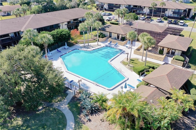 48 Club House Dr Unit 106, Palm Coast, FL 32137 - community pool with a residential view and fence